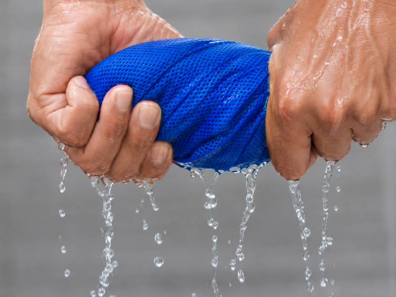 Wring: activating a blue DesertTowel cooling towel with water